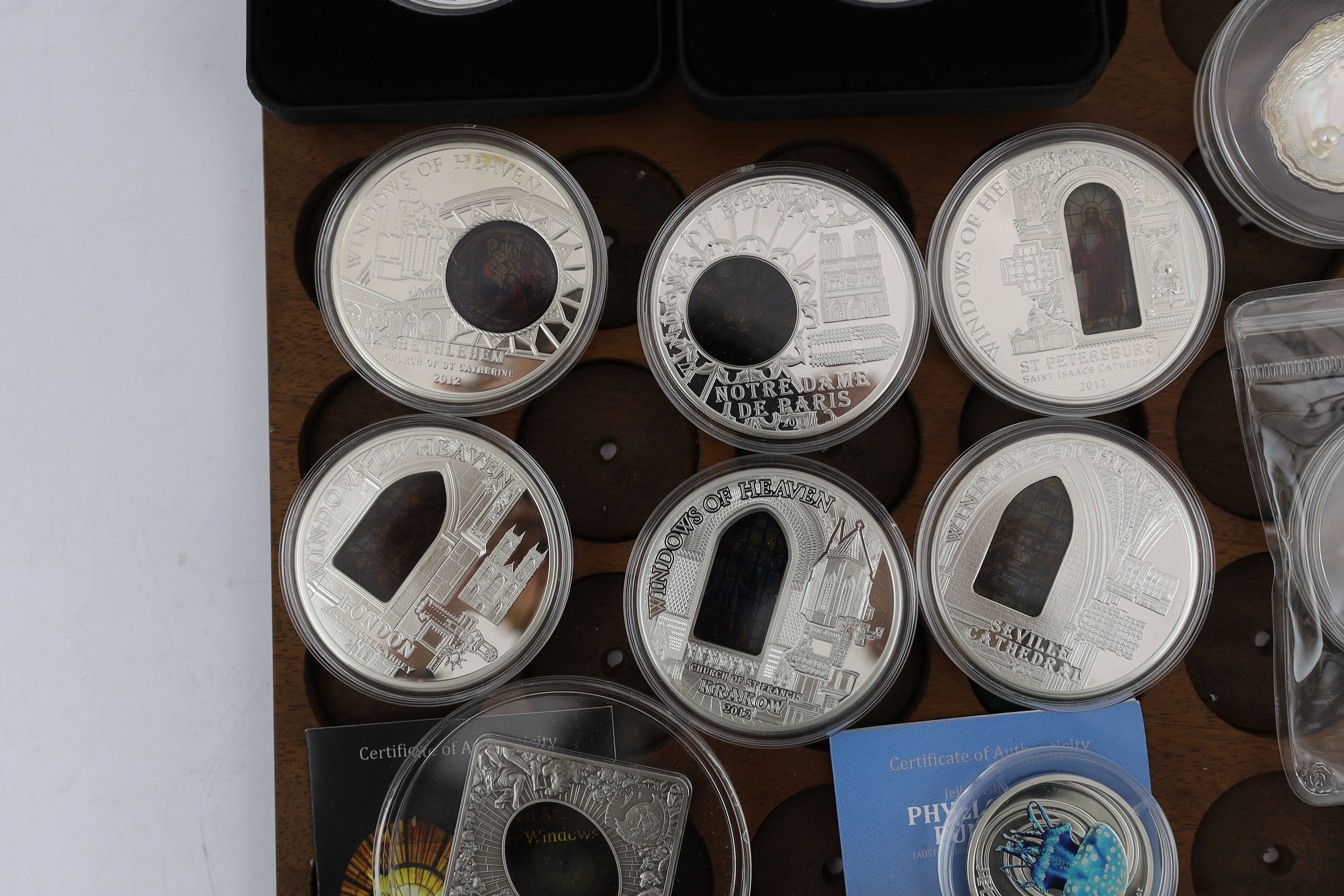 Elizabeth II Cook Islands silver proof commemorative coins, six windows of heaven $10, a Christmas 2009 $5, Republic of Palau shells of the sea 2011 $5 ‘pearl oyster’, Sacred Art Holy Windows 2011 $10, two Fiji Nefertiti